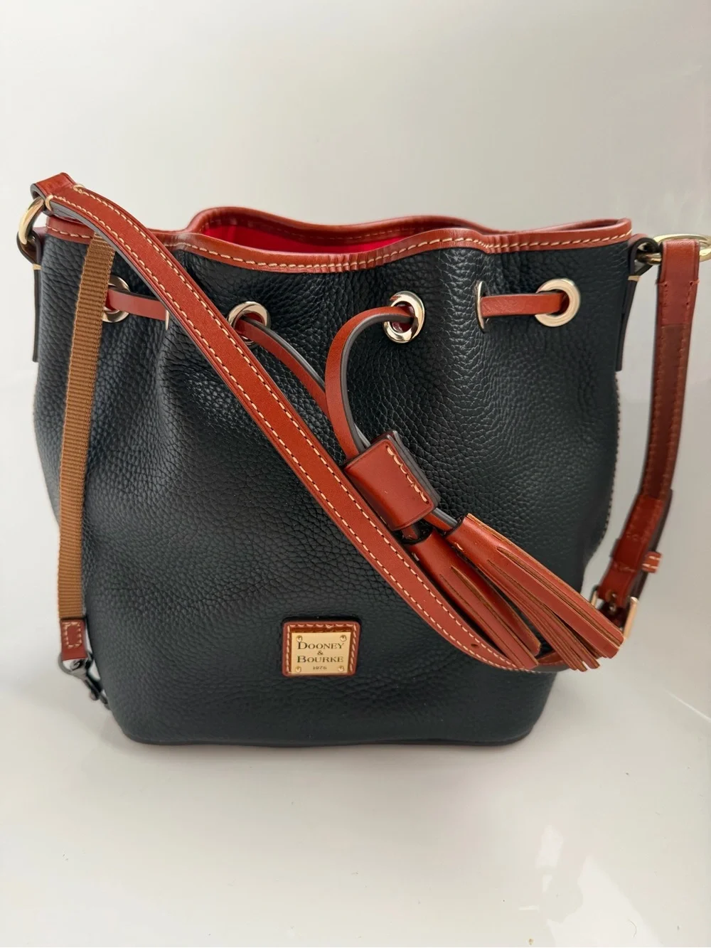 Dooney & Bourke Black Pebble Leather Bucket Bag with Tan Trim